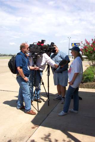 Maggie facing more of the Dallas press.